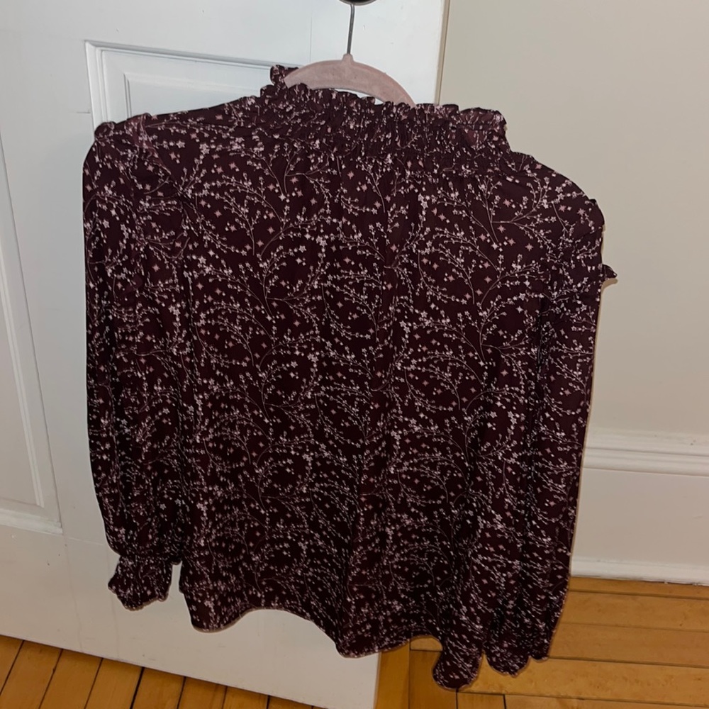 Purple mock neck blouse with white flowery design